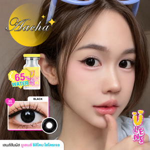 Close-up of a person with contact lenses and Aacha contact lens solution packaging.