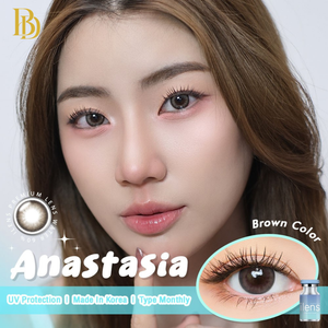 Advertisement for Anastasia brown contact lenses with a model wearing them.