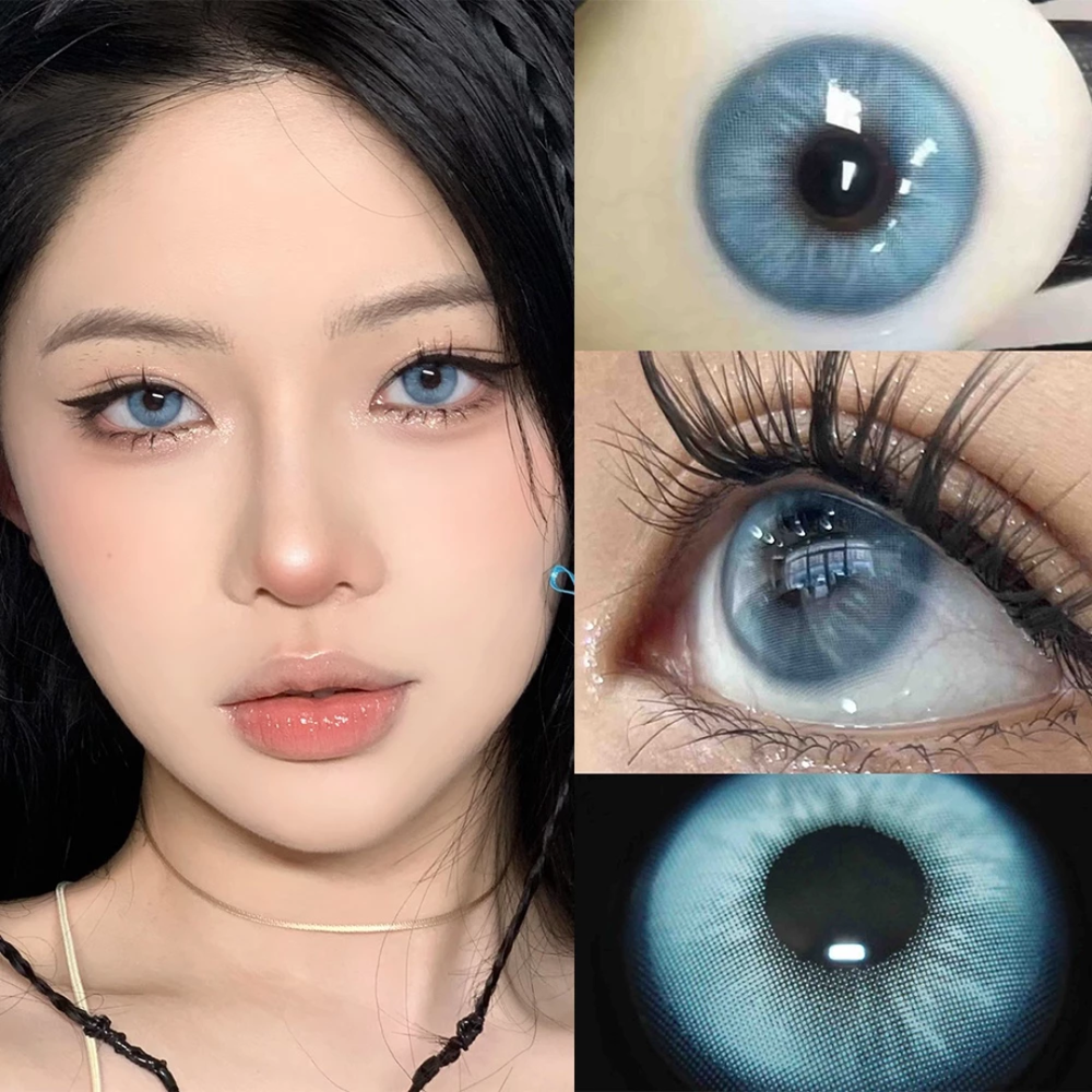 Close-up of a person with blue eyes and dark hair, wearing a light blue top.
