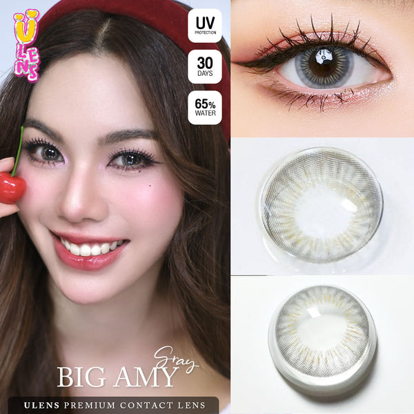 Advertisement for ULENS BIG AMY gray contact lenses with a model wearing them, close-up of eyes, and contact lenses.