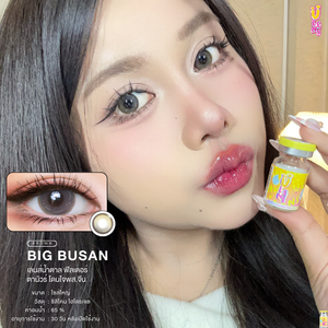 Person holding a bottle of eye drops with close-up of eyes wearing contact lenses and product details.