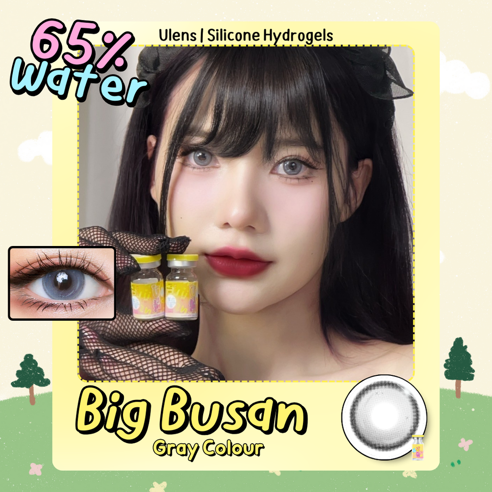 Advertisement for Big Busan gray contact lenses with a model wearing them, showing close-up of eyes and contact lens.