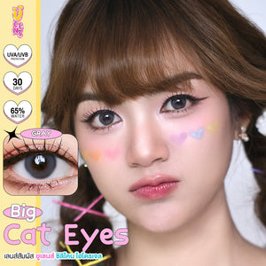 Advertisement for 'Big Cat Eyes' contact lenses with a close-up of a person wearing them.