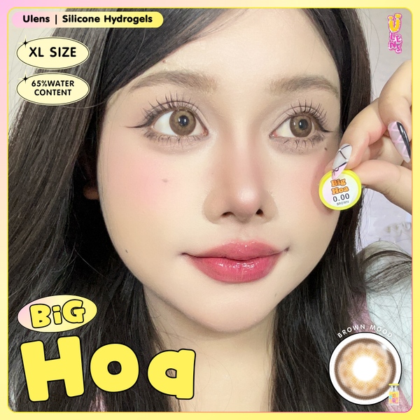 Person holding a contact lens with product details on a yellow border
