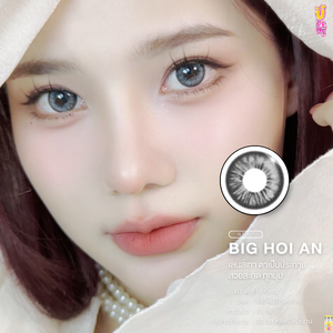 Close-up of a person wearing contact lenses with a brand logo in the corner.