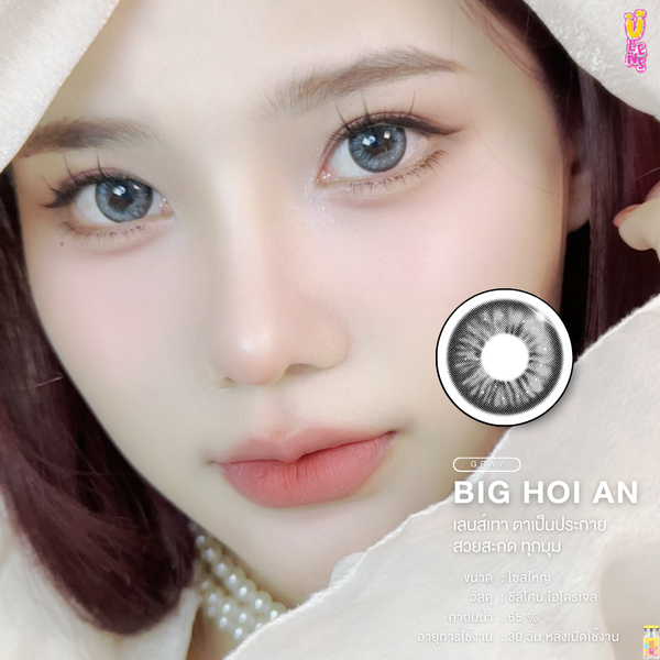 Close-up of a person wearing contact lenses with a brand logo in the corner.