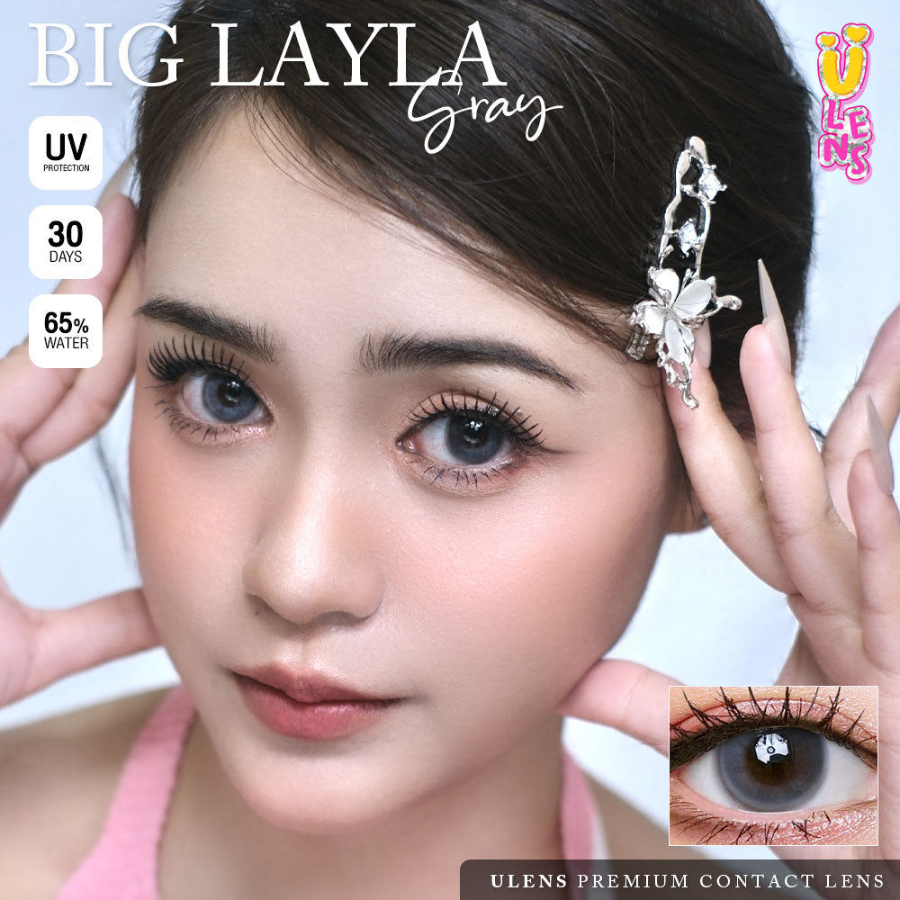 Advertisement for Big Layla contact lenses with a model wearing them, close-up of eye, and product packaging.