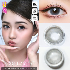 Advertisement for Big Layla contact lenses showing a model, close-up of eyes, and contact lenses.