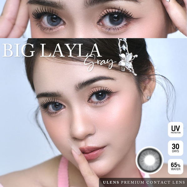 Advertisement for Big Layla gray contact lenses with a close-up of eyes and product details.