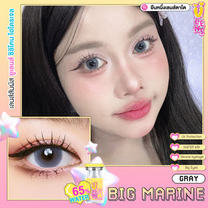 Advertisement for gray contact lenses with close-up of eyes and product packaging.