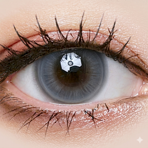 Close-up of a gray contact lens worn in an eye