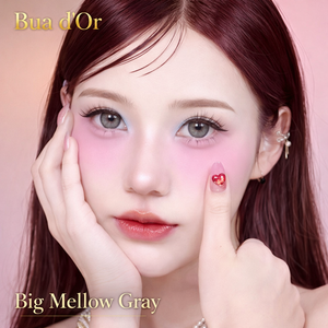 Model with makeup and 'Bua d'Or' branding on a pink background