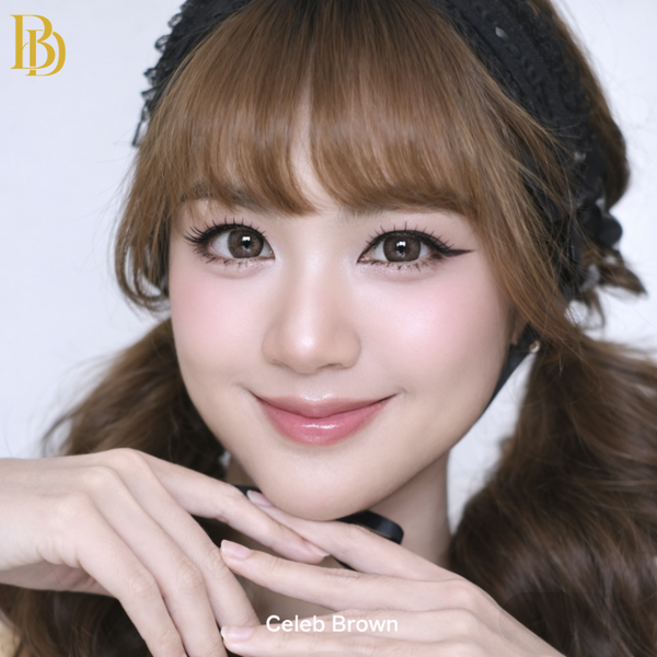 Close-up of a person with styled hair and makeup, featuring the brand 'Celeb Brown'.