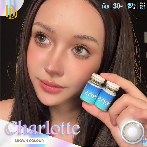 A close-up of a woman holding two small blue contact lens vials next to her face, with text overlays reading 'Charlotte', 'Brown Colour', and product specs in the top right corner.