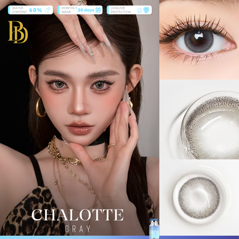 A close-up of a model wearing gray contact lenses, with gold hoop earrings and layered gold necklaces against a black background. The image includes text overlays highlighting product features such as water content, monthly wear, UV protection, and the color name 'CHALOTTE GRAY' alongside a circular lens graphic.