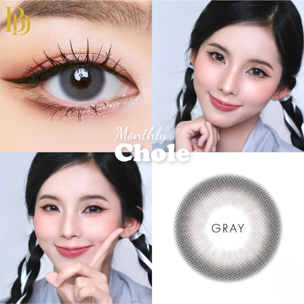 Close-up of a person wearing gray contact lenses with 'Monthly Chole' branding.