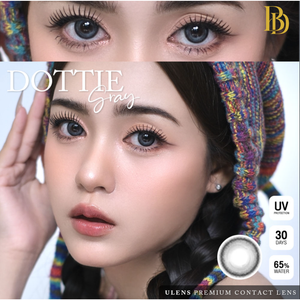Contact lens advertisement with model wearing colorful headscarf and contact lenses.