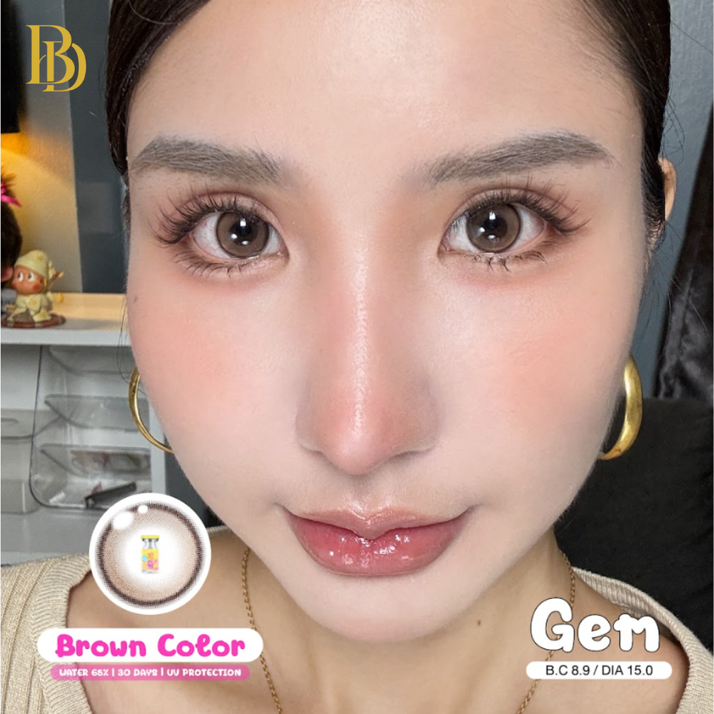 Close up of a woman's face with brown contact lenses - Gem Brown Color