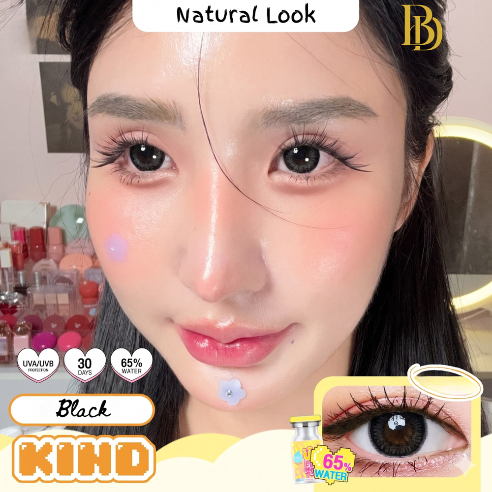 Advertisement for black contact lenses with a close-up of an eye and product packaging on a yellow background.
