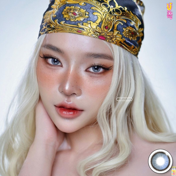Person with blonde hair and decorative headband on a white background