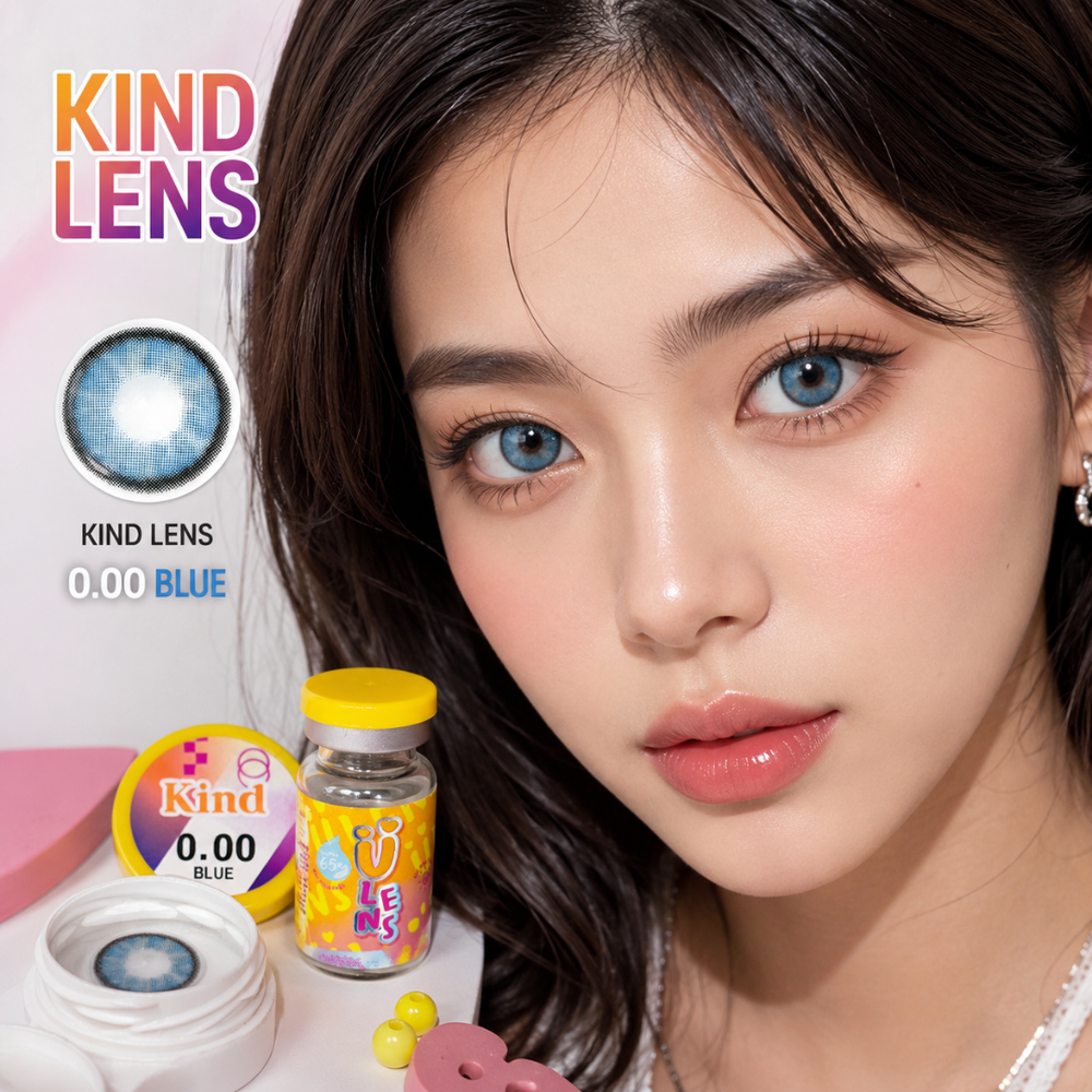 Close-up of a woman wearing blue contact lenses, with product packaging and a contact lens display jar shown beside her. The image includes the text 'KIND LENS' and 'KIND LENS 0.