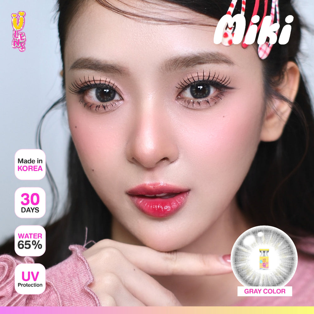 Advertisement for Miki fashion contact lenses with a model wearing them, showing product details.
