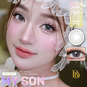 Close-up of a person wearing a lace headband with contact lens packaging and branding visible.