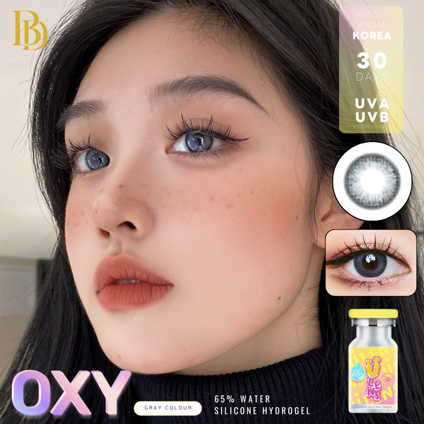Advertisement for OXY contact lenses with a model wearing them, showing close-up details and product packaging.