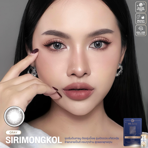 Woman with dark hair and Siri Mongkol gray contact lenses, with contact lens packaging and product details on a gray background.