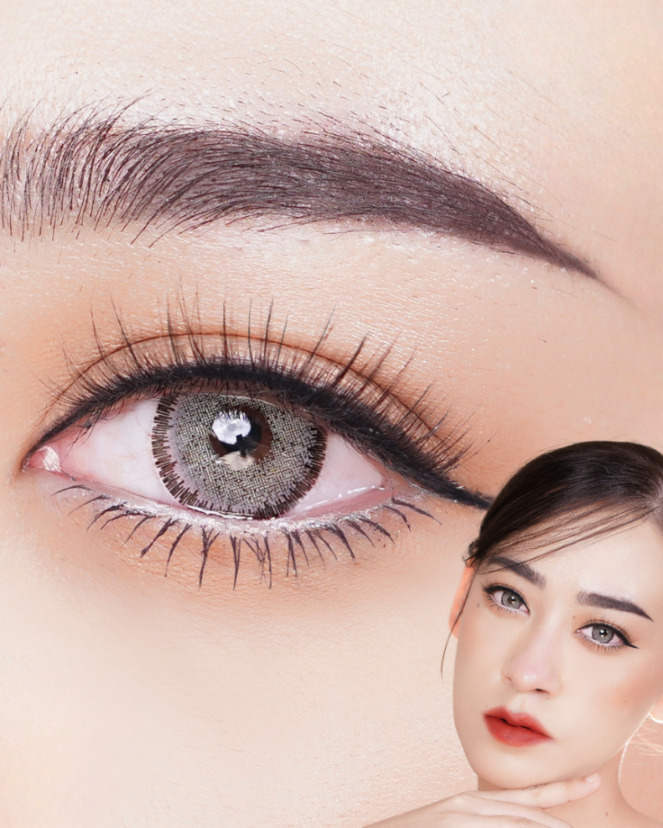 Close-up of a woman's eye with detailed makeup, including eyelashes and eyeliner.