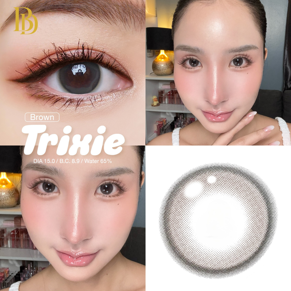 Close-up of a person holding a contact lens with 'Brown Trixie' branding.