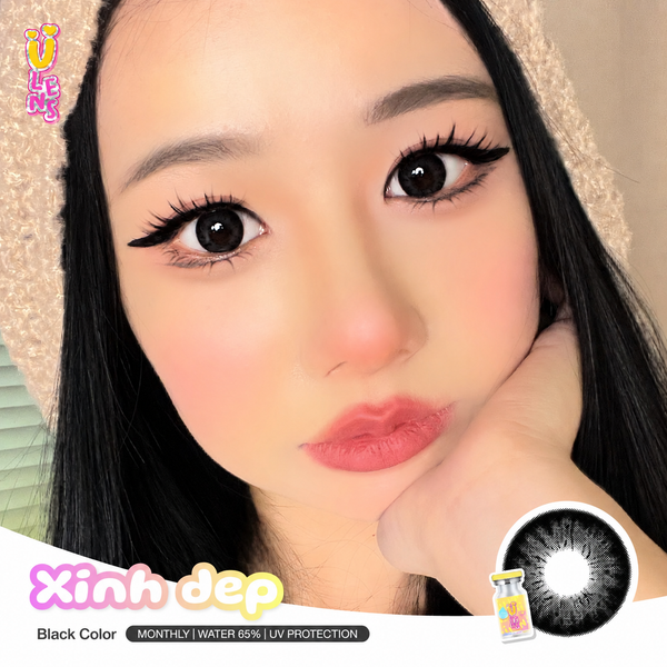Close-up of a person with long eyelashes and a hand on their chin, with 'Xinh dep' contact lenses branding.